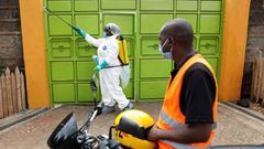 A Nairobi municipality worker sprays disinfectant in an effort to fight against the spread of the coronavirus disease (COVID-19) in the Kawangware neighborhood of Nairobi, Kenya, May 2, 2020. REUTERS/Baz Ratner
