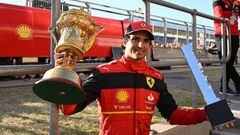 Ferrari's Spanish driver Carlos Sainz Jr poses with the winner's trophies after the Formula One British Grand Prix at the Silverstone motor racing circuit in Silverstone, central England on July 3, 2022. (Photo by JUSTIN TALLIS / AFP) (Photo by JUSTIN TALLIS/AFP via Getty Images)