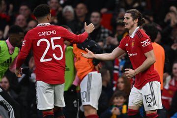 Marcel Sabitzer (R) celebrates with Manchester United's Jadon Sancho (L) after scoring their second goal during the English FA Cup quarter-final match between Manchester United and Fulham at Old Trafford.