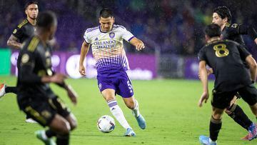 Orlando City midfielder César Araújo (5) dribbles past Los Angeles FC defenders during an MLS soccer match in Orlando, Fla., Saturday, April 2, 2022. (Willie J. Allen Jr./Orlando Sentinel via AP)