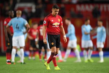 It's over | Alexis Sanchez of Manchester United looks dejected after the Premier League match against Manchester City.