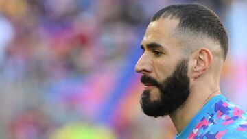 (FILES) In this file photo taken on October 24, 2021 Real Madrid&#039;s French forward Karim Benzema looks on as he warms up prior to the Spanish League football match between FC Barcelona and Real Madrid CF at the Camp Nou stadium in Barcelona. - The jud