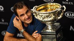 Switzerland&#039;s Roger Federer speaks next to the championship trophy during a press conference after his victory against Spain&#039;s Rafael Nadal in the men&#039;s singles final on day 14 of the Australian Open tennis tournament in Melbourne on Januar