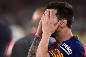 Messi holds his head in his hands after Barcelona's Copa del Rey final defeat to Valencia on Saturday night.