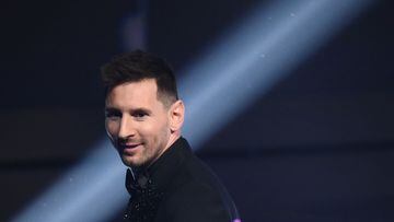 Argentina and Paris Saint-Germain forward Lionel Messi poses on stage after receiving the Best FIFA Men�s Player award during the Best FIFA Football Awards 2022 ceremony in Paris on February 27, 2023. (Photo by FRANCK FIFE / AFP)