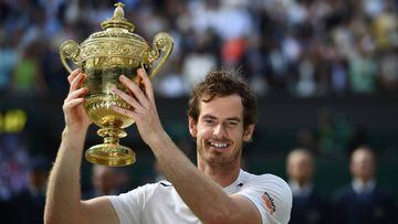 Britain&#039;s Andy Murray posing with the winner&#039;s trophy after his men&#039;s singles final victory over Canada&#039;s Milos Raonic on the last day of the 2016 Wimbledon Championships