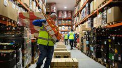 Staff for the charity &#039;His Church&#039; prepare pallets of food and supplies which will be distributed to charities and community support networks across the UK from their warehouse near Market Rasen, northern England on April 14, 2020. - His Church 
