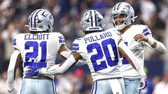 ARLINGTON, TEXAS - OCTOBER 23: Dak Prescott #4 of the Dallas Cowboys celebrates with Ezekiel Elliott #21 and Tony Pollard #20 after a touchdown against the Detroit Lions during the fourth quarter at AT&T Stadium on October 23, 2022 in Arlington, Texas.   Tom Pennington/Getty Images/AFP