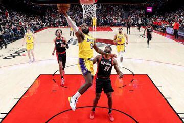 PORTLAND, OREGON - FEBRUARY 09: LeBron James #6 of the Los Angeles Lakers shoots against Justise Winslow #26 of the Portland Trail Blazers during the first quarter at Moda Center on February 09, 2022 in Portland, Oregon.