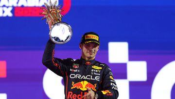 JEDDAH, SAUDI ARABIA - MARCH 27: Race winner Max Verstappen of the Netherlands and Oracle Red Bull Racing celebrates on the podium during the F1 Grand Prix of Saudi Arabia at the Jeddah Corniche Circuit on March 27, 2022 in Jeddah, Saudi Arabia. (Photo by