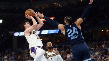 Apr 16, 2023; Memphis, Tennessee, USA; Los Angeles Lakers guard Austin Reaves (15) shoots as Memphis Grizzlies forward Dillon Brooks (24) defends during the first half during game one of the 2023 NBA playoffs at FedExForum. Mandatory Credit: Petre Thomas-USA TODAY Sports