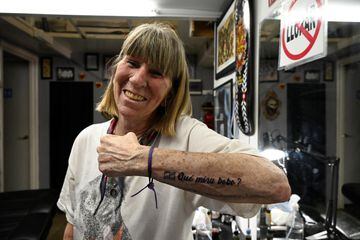 Maria Celia, 68, poses for a photo, showing a tattoo with the phrase "Que mira, bobo?" (What are you lookin' at, fool?), said by Argentine soccer star Lionel Messi during his match against the Netherlands, after Argentina won FIFA World Cup Qatar 2022, in Buenos Aires, Argentina, December 19, 2022. REUTERS/Magali Druscovich'