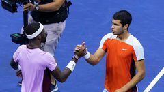 Spain's Carlos Alcaraz (R) greets USA's Frances Tiafoe (L) after winning following their 2022 US Open Tennis tournament men's singles semi-final match at the USTA Billie Jean King National Tennis Center in New York, on September 9, 2022. (Photo by Corey Sipkin / AFP)