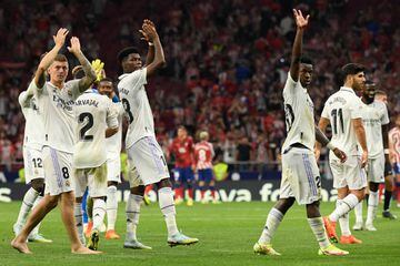Madrid players celebrate victory at the end of the Spanish League football match between Club Atletico de Madrid and Real Madrid 