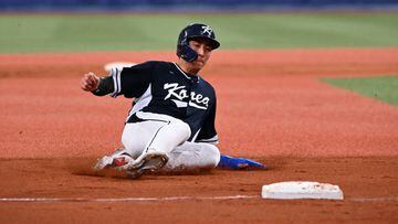 OSAKA, JAPAN - MARCH 06: Outfielder Jung Hoo Lee #51 of Korea slides safely into the third base in the ninth inning during the World Baseball Classic exhibition game between Korea and Orix Buffaloes at Kyocera Dome Osaka on March 6, 2023 in Osaka, Japan. (Photo by Kenta Harada/Getty Images)