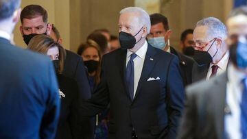 U.S. President Joe Biden walks with House Speaker Nancy Pelosi (D-CA) and Senate Majority Leader Chuck Schumer (D-NY) after paying his respects at the casket of former Senate majority leader Harry Reid.