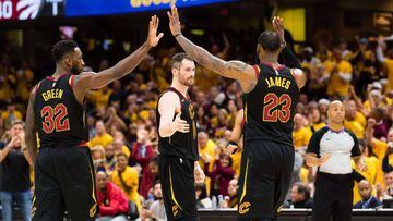 CLEVELAND, OH - MAY 7: Jeff Green #32, Kevin Love #0 and LeBron James #23 of the Cleveland Cavaliers celebrate during a timeout against the Toronto Raptors during the first half of Game 4 of the second round of the Eastern Conference playoffs at Quicken L