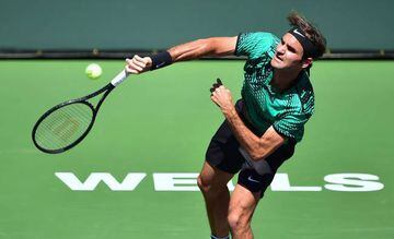 Roger Federer of Switzerland serves to Jack Sock of the US in their men's semifinal ATP Indian Wells Masters in Indian Wells, California on March 18, 2017 where Federer defeated Sock 6-1, 7-6 (7/4).
