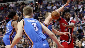WASHINGTON, DC - FEBRUARY 13: John Wall #2 of the Washington Wizards passes the ball in the second half against the Oklahoma City Thunder at Verizon Center on February 13, 2017 in Washington, DC. NOTE TO USER: User expressly acknowledges and agrees that, 