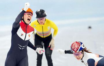 2022 Beijing Olympics - Short Track Speed Skating - Women's 1000m - Final A - Capital Indoor Stadium, Beijing, China - February 11, 2022. Suzanne Schulting of the Netherlands reacts as she crosses the line to win gold ahead of silver medallist Choi Min-je
