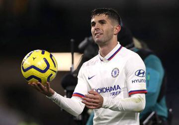 Chelsea's Christian Pulisic celebrates with the match ball