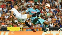 VALENCIA, SPAIN - AUGUST 20:  Gabriel Paulista of Valencia and Diego Costa of Atletico Madrid in action during the La Liga match between Valencia CF and  Club Atletico de Madrid at Estadio Mestalla on August 20, 2018 in Valencia, Spain.  (Photo by David R