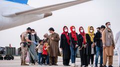 People disembark a plane at Torrejon de Ardoz airbase in Madrid upon their arrival after being evacuated from Afghanistan in the aftermath of the Taliban takeover. 
