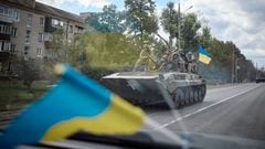 Ukrainian service members ride on an armoured fighting vehicle in the town of Kupiansk, recently liberated by the Armed Forces, amid Russia's attack on Ukraine, in Kharkiv region.