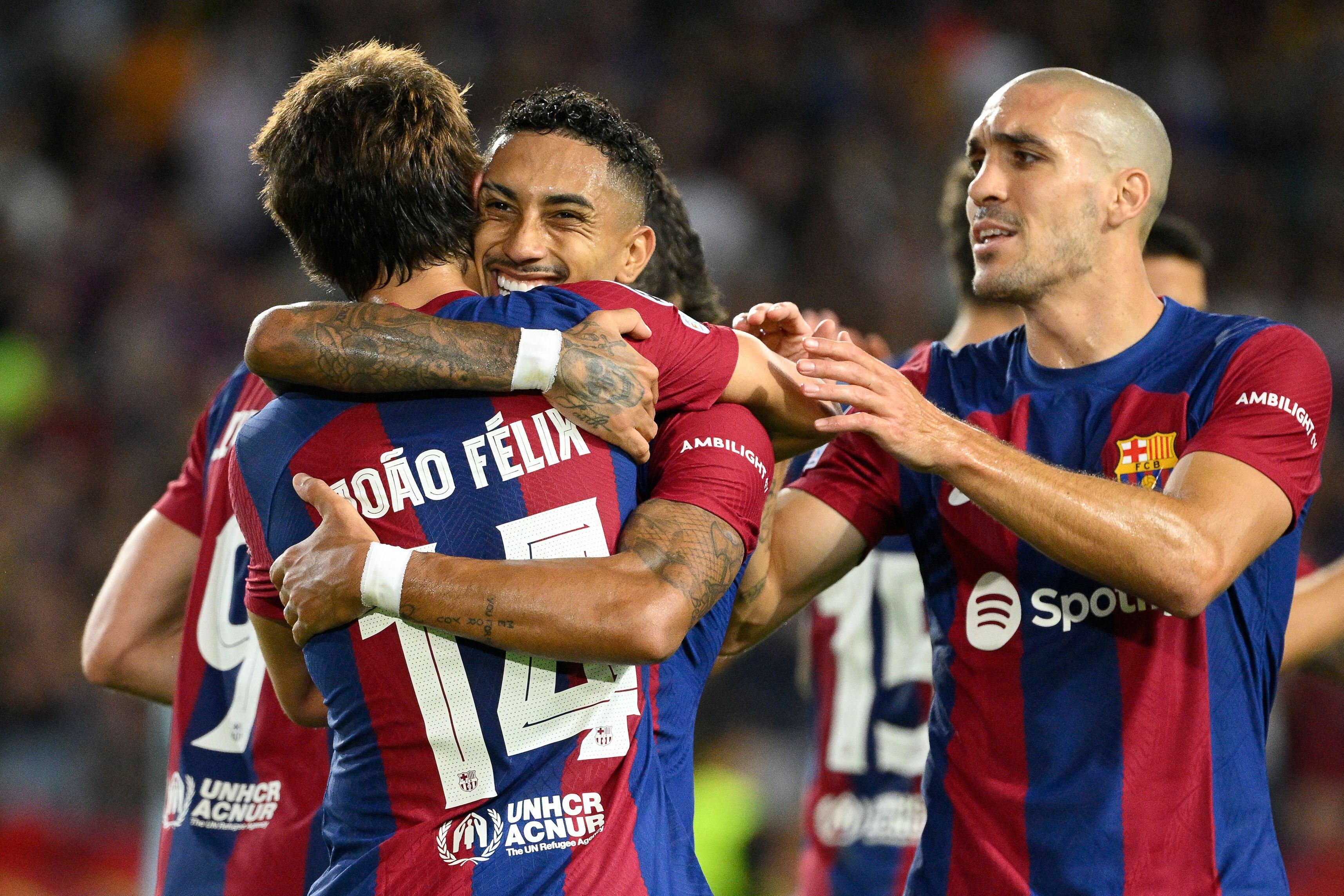 Barcelona's Portuguese forward #14 Joao Felix celebrates with teammates after scoring his team's fifth goal during the UEFA Champions League 1st round day 1 Group H football match between FC Barcelona and Royal Antwerp FC at the Estadi Olimpic Lluis Companys in Barcelona on September 19, 2023. (Photo by Josep LAGO / AFP)