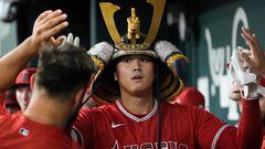 ARLINGTON, TEXAS - AUGUST 16: Shohei Ohtani #17 of the Los Angeles Angels is congratulated in his dugout after hitting a solo home run during the first inning against the Texas Rangers at Globe Life Field on August 16, 2023 in Arlington, Texas.   Sam Hodde/Getty Images/AFP (Photo by Sam Hodde / GETTY IMAGES NORTH AMERICA / Getty Images via AFP)