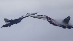 FILE PHOTO: Sukhoi Su-27 Flanker fighters of the Russkiye Vityazi (Russian Knights) aerobatic display team perform during a demonstration flight at the opening ceremony of the International Army Games in Alabino, outside Moscow, Russia, August 1, 2015. REUTERS/Maxim Shemetov/File Photo