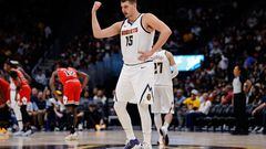Denver Nuggets center Nikola Jokic (15) gestures to the bench in the second quarter against the Chicago Bulls at Ball Arena.