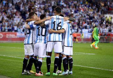 HARRISON, NEW JERSEY - SEPTEMBER 27: Lionel Messi #10 of Argentina is congratulated by teammates after he scored in the second half against Jamaica at Red Bull Arena on September 27, 2022 in Harrison, New Jersey. Argentina defeated Jamaica 3-0.   Elsa/Getty Images/AFP