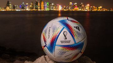 DOHA, QATAR - MARCH 31: In this photo illustration an official FIFA World Cup Qatar 2022 ball sits on display in front of the skyline of Doha ahead of the FIFA World Cup Qatar 2022 draw on March 31, 2022 in Doha, Qatar. (Photo by David Ramos/Getty Images)