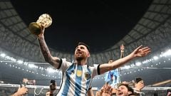 LUSAIL CITY, QATAR - DECEMBER 18: Lionel Messi of Argentina celebrates with the FIFA World Cup Qatar 2022 Winner's Trophy after the team's victory during the FIFA World Cup Qatar 2022 Final match between Argentina and France at Lusail Stadium on December 18, 2022 in Lusail City, Qatar. (Photo by Shaun Botterill - FIFA/FIFA via Getty Images)