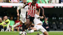 Real Madrid's Spanish midfielder Dani Ceballos (R) tackles Athletic Bilbao's Spanish forward Nico Williams during the Spanish league football match between Real Madrid CF and Athletic Club Bilbao at the Santiago Bernabeu stadium in Madrid on June 4, 2023. (Photo by Pierre-Philippe MARCOU / AFP)