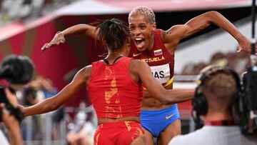 Tokyo 2020 Olympics - Athletics - Women&#039;s Triple Jump - Final - OLS - Olympic Stadium, Tokyo, Japan &ndash; August 1, 2021. Yulimar Rojas of Venezuela reacts after winning the gold medal and breaking the world record with Ana Peleteiro of Spain who won the silver medal REUTERS/Dylan Martinez