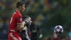 Bayern&#039;s Benjamin Pavard, left, and Lyon&#039;s Rayan Cherki fight for the ball during the Champions League semifinal soccer match between Lyon and Bayern Munich at the Jose Alvalade stadium in Lisbon, Portugal, Wednesday, Aug. 19, 2020. (Miguel A. L