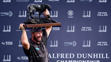 MALELANE, SOUTH AFRICA - DECEMBER 11: Ockie Strydom of South Africa lifts the Alfred Dunhill Championship trophy after winning the Championship during Day Four of the Alfred Dunhill Championship at Leopard Creek Country Club on December 11, 2022 in Malelane, South Africa. (Photo by Warren Little/Getty Images)