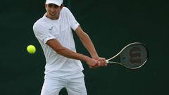 LONDON, ENGLAND - JUNE 28: Daniel Elahi Galan of Colombia plays a backhand against Dominik Koepfer of Germany during their Men's Singles First Round Match on day two of The Championships Wimbledon 2022 at All England Lawn Tennis and Croquet Club on June 28, 2022 in London, England. (Photo by Julian Finney/Getty Images)