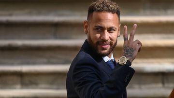 (FILES) In this file photo taken on October 18, 2022 Paris Saint-Germain's Brazilian forward Neymar gestures as he leaves after attending a hearing at the courthouse in Barcelona on October 18, 2022, on the second day of his trial. - Prosecutors in Spain dropped corruption and fraud charges on October 28, 2022 against football star Neymar and others accused in a trial over the Brazilian's 2013 move from Santos to Barcelona. (Photo by Josep LAGO / AFP)