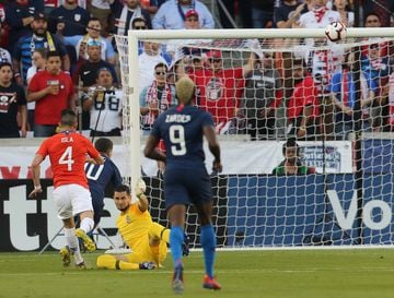 Mar 26, 2019; Houston, TX, USA; United States of America midfielder Christian Pulisic (10) scores on Chile goalkeeper Gabriel Arias (1) in the first half during an international friendly soccer match at BBVA Compass Stadium. Mandatory Credit: Thomas B. Shea-USA TODAY Sports