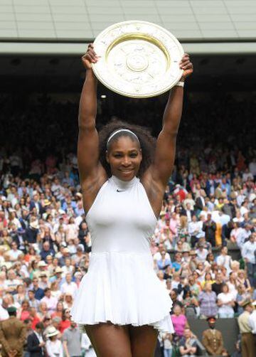 Serena Williams with the winners trophy after defeating Angelique Kerber in the women's final of the Wimbledon Tennis Championships at Wimbledon on July 09, 2016 in London, England.