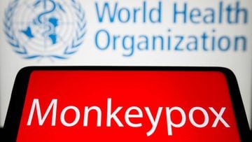 UKRAINE - 2022/05/21: In this photo illustration, the word Monkeypox is seen on the screen of a smartphone with the World Health Organization (WHO) logo in the background. (Photo Illustration by Pavlo Gonchar/SOPA Images/LightRocket via Getty Images)
