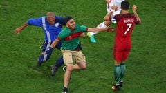 Pitch invader at Portugal match tries to hug Cristiano Ronaldo