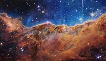 The "Cosmic Cliffs" of the Carina Nebula.
