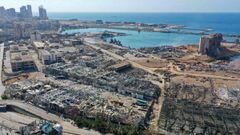 An aerial view shows the massive damage done to Beirut port&#039;s grain silos (C) and the area around it on August 5, 2020, one day after a mega-blast tore through the harbour in the heart of the Lebanese capital with the force of an earthquake, killing 