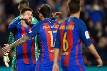 Barcelona's forward Paco Alcacer (R) celebrates with Barcelona's Argentinian forward Lionel Messi (L) after scoring during the Spanish league football match FC Barcelona vs Real Sporting de Gijon at the Camp Nou stadium in Barcelona on March 1, 2017. / AF