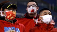 Soccer Football - World Cup - Asian Qualifiers - Group B - Japan v China - Saitama Stadium, Saitama, Japan - January 27, 2022  China fans wear protective face masks inside the stadium before the match REUTERS/Issei Kato