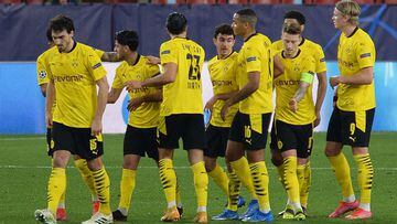 Dortmund&#039;s players celebrate after scoring a goal during the UEFA Champions League round of 16 first leg football match between Sevilla FC and Borussia Dortmund on February 17, 2021 at the Ramon Sanchez Pizjuan stadium in Seville. (Photo by CRISTINA 